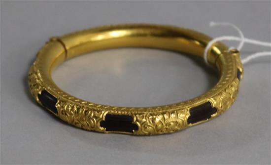 A Chinese high carat gold mounted hinged bangle,